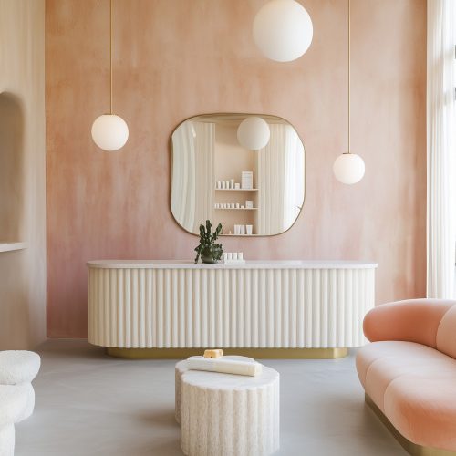 Elegant spa reception with pastel decor and modern furniture.